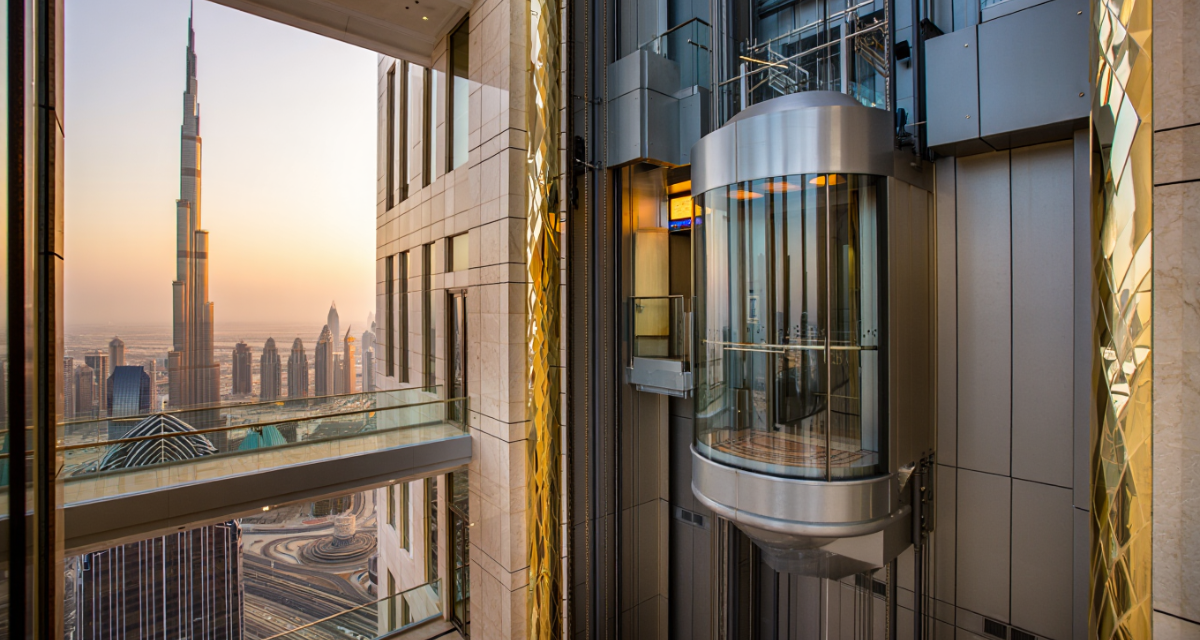 Modern panoramic glass elevator installed inside a luxury commercial building showcasing stylish glass elevators in UAE with contemporary architectural design