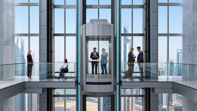 Futuristic glass lift with transparent panoramic cabin installed in a luxury high-rise showcasing innovative glass elevators in UAE