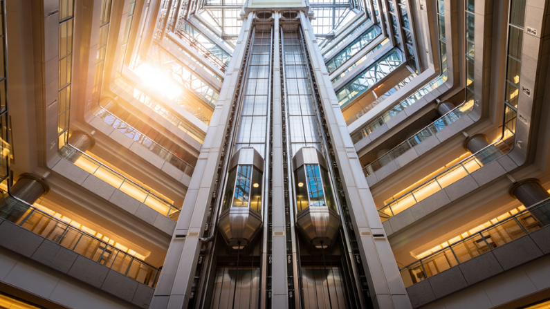 Different types of passenger elevators in UAE used in commercial buildings including traction and machine-room-less elevators