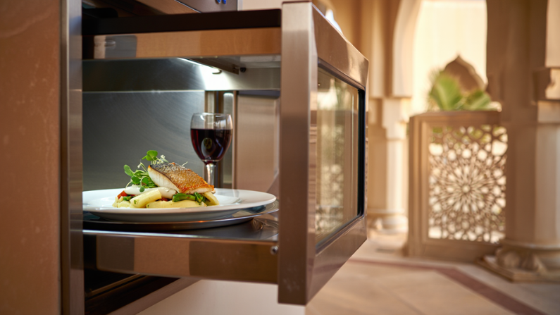 Modern dumbwaiter lift installed in a UAE restaurant and luxury villa, providing efficient vertical transportation of food, groceries, and household items between floors.